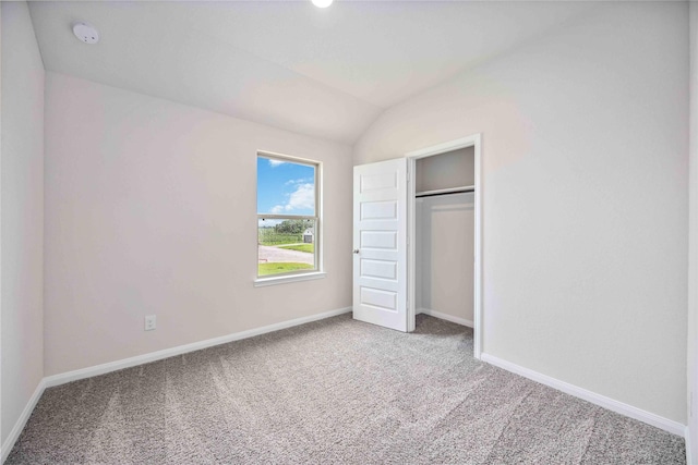 16853 Needlepoint Dr, Conroe, TX 77302 - unfurnished bedroom featuring carpet floors, vaulted ceiling, and a closet