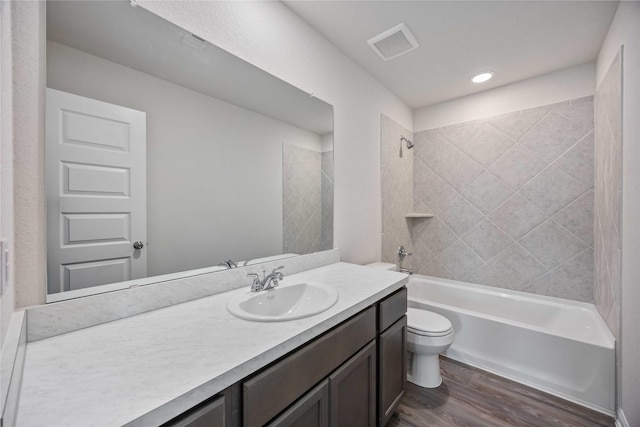 16853 Needlepoint Dr, Conroe, TX 77302 - bathroom featuring vanity, wood finished floors, and shower / washtub combination