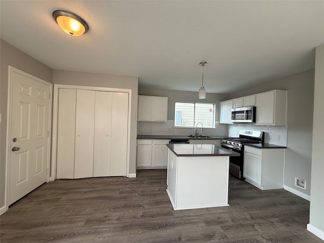 1091 Verde Trails Dr, Houston, TX 77073 - kitchen with appliances with stainless steel finishes, dark countertops, tasteful backsplash, and white cabinets