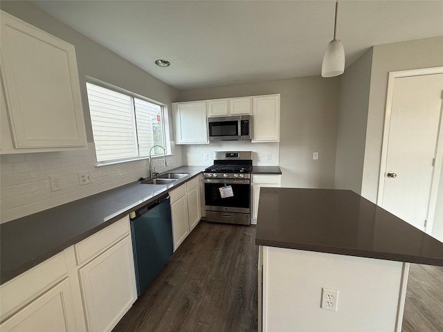 1091 Verde Trails Dr, Houston, TX 77073 - kitchen with appliances with stainless steel finishes, dark countertops, dark wood finished floors, and tasteful backsplash