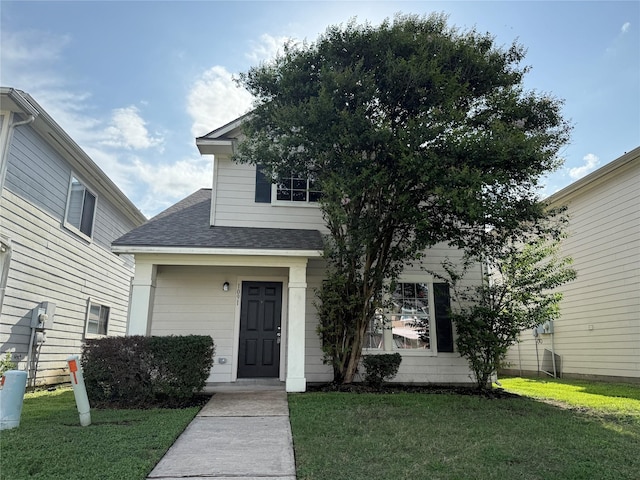 1091 Verde Trails Dr, Houston, TX 77073 - obstructed view of property featuring a shingled roof and a front yard