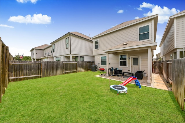 3923 Calasso Ct, Katy, TX 77493 - rear view of property with a patio, a fenced backyard, and a fire pit