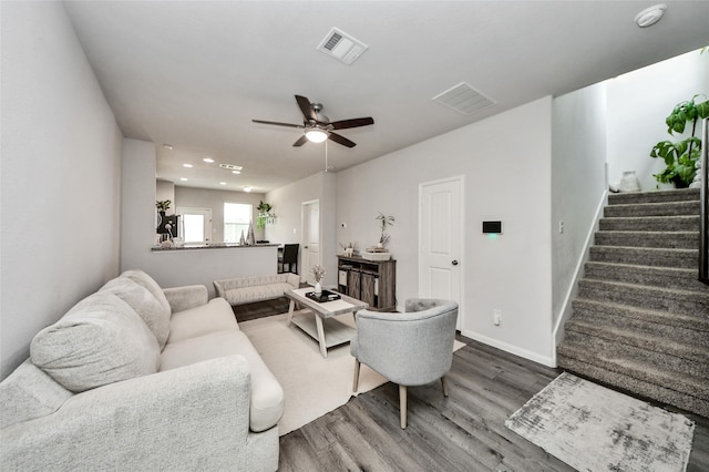3923 Calasso Ct, Katy, TX 77493 - living area featuring wood finished floors, stairs, ceiling fan, and recessed lighting