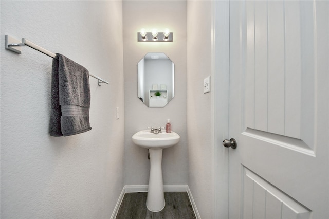 3923 Calasso Ct, Katy, TX 77493 - bathroom featuring baseboards and wood finished floors