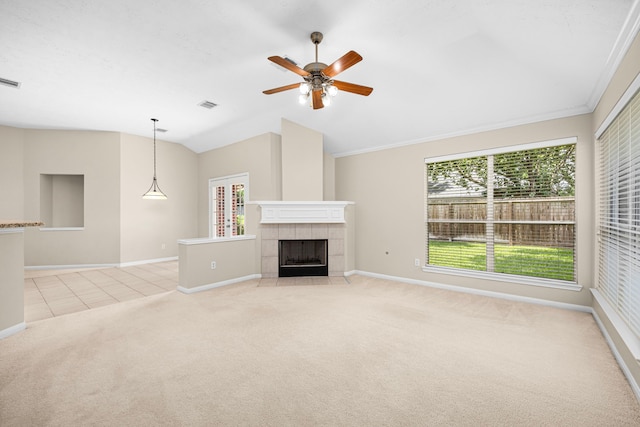 17130 Mountain Crest Dr, Spring, TX 77379 - unfurnished living room with light colored carpet, vaulted ceiling, ceiling fan, a fireplace, and light tile patterned flooring