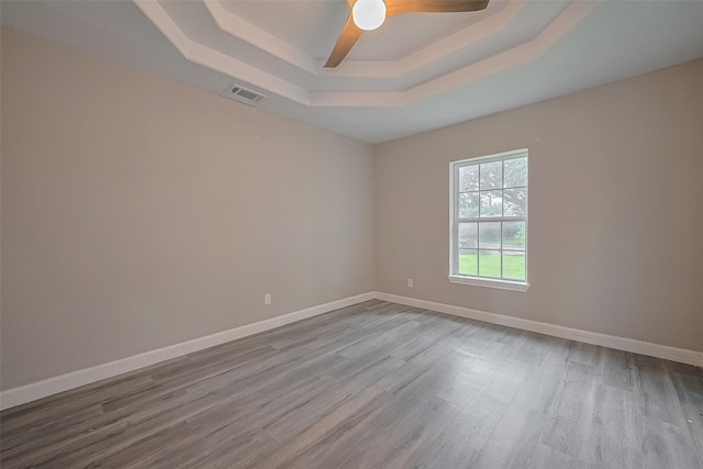 11502 Leader St, Houston, TX 77072 - spare room with a raised ceiling, wood finished floors, and a ceiling fan