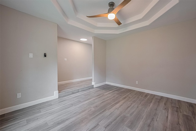 11502 Leader St, Houston, TX 77072 - empty room featuring a raised ceiling, a ceiling fan, and wood finished floors
