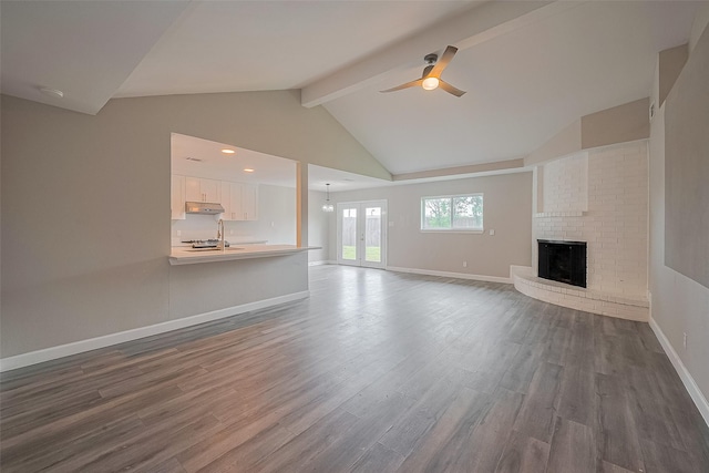 11502 Leader St, Houston, TX 77072 - unfurnished living room with a ceiling fan, dark wood-style flooring, and a brick fireplace
