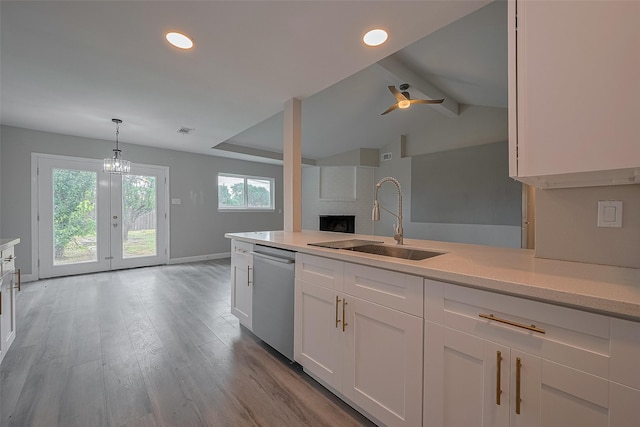 11502 Leader St, Houston, TX 77072 - kitchen with dishwasher, light countertops, light wood-style flooring, white cabinets, and recessed lighting