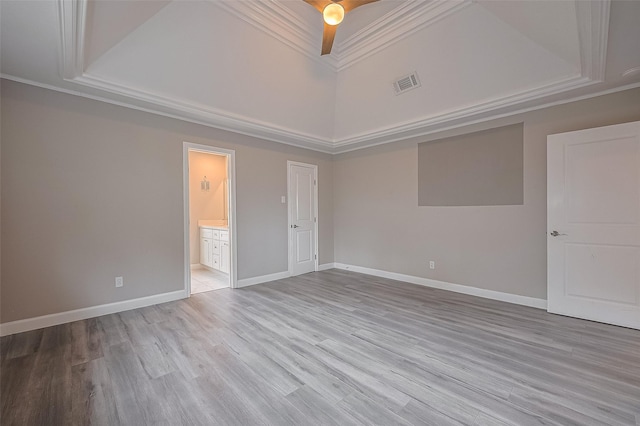 11502 Leader St, Houston, TX 77072 - unfurnished room featuring a tray ceiling, crown molding, light wood-type flooring, a high ceiling, and a ceiling fan