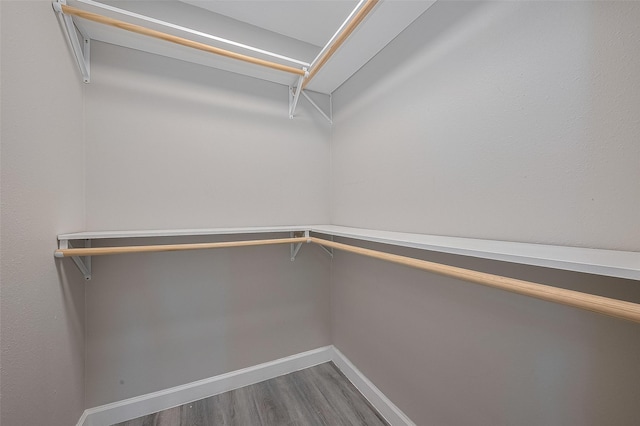 11502 Leader St, Houston, TX 77072 - walk in closet featuring wood finished floors