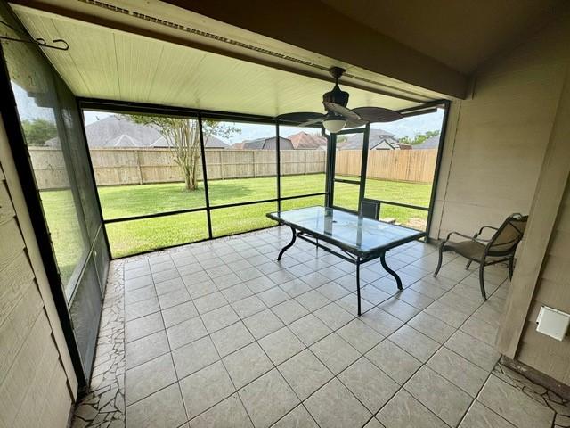 108 Audubon Woods Dr, Richwood, TX 77531 - unfurnished sunroom featuring a ceiling fan