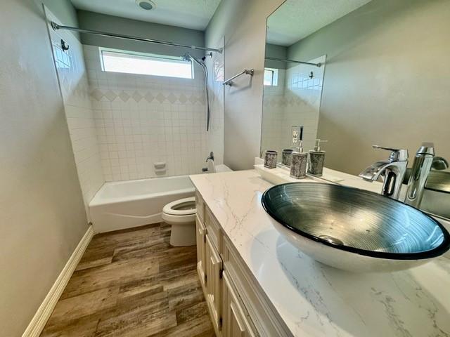 108 Audubon Woods Dr, Richwood, TX 77531 - full bathroom with tub / shower combination, vanity, and wood finished floors