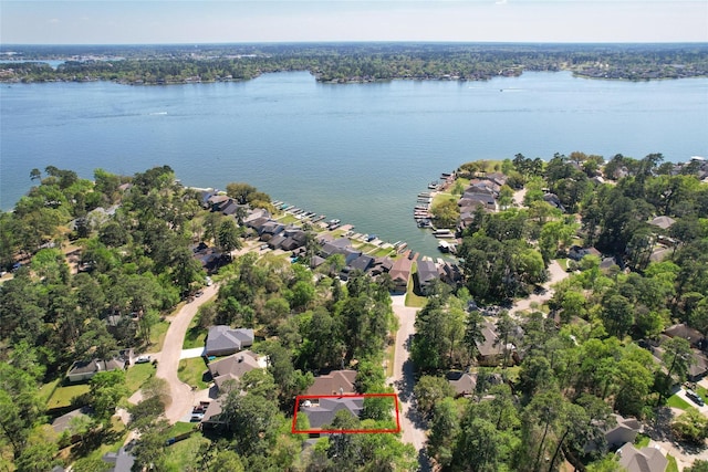 11210 Walden Rd, Montgomery, TX 77356 - aerial view of residential area featuring property boundaries highlighted and a large body of water