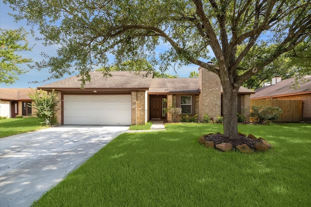 604 Briarclift Ln, Baytown, TX 77521 - view of front facade with a garage, driveway, roof with shingles, and a chimney
