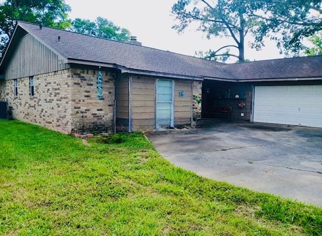 903 Happy Holw, Sweeny, TX 77480 - view of front facade with driveway, an attached garage, a front yard, and a chimney