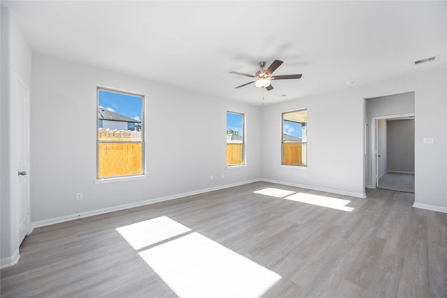 16866 Needlepoint Dr, Conroe, TX 77302 - empty room with a ceiling fan and wood finished floors