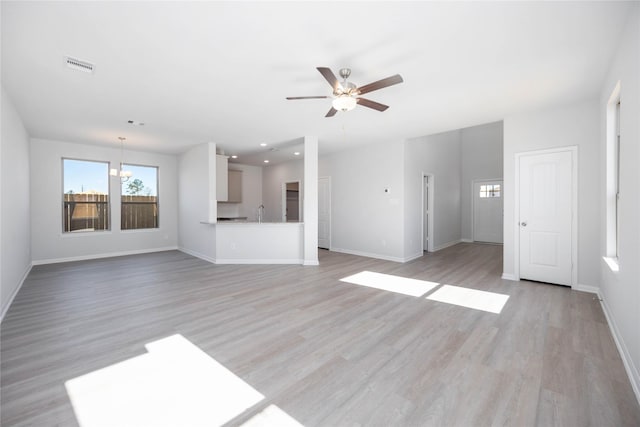 16866 Needlepoint Dr, Conroe, TX 77302 - unfurnished living room with healthy amount of natural light, ceiling fan, light wood-style floors, and recessed lighting