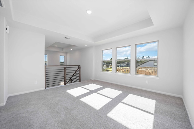 16866 Needlepoint Dr, Conroe, TX 77302 - unfurnished room with a tray ceiling, carpet floors, and recessed lighting