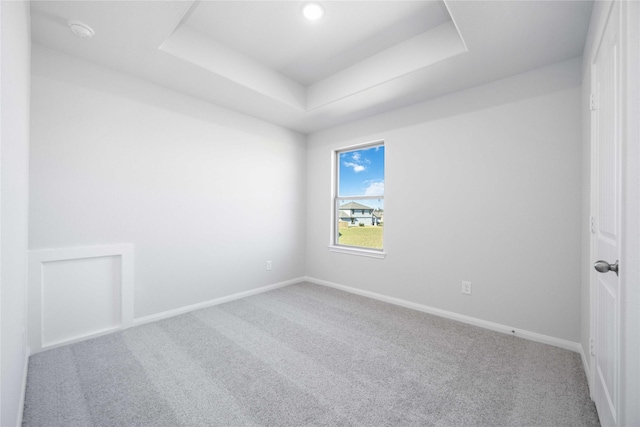 16866 Needlepoint Dr, Conroe, TX 77302 - unfurnished room with a raised ceiling, carpet flooring, and a smoke detector