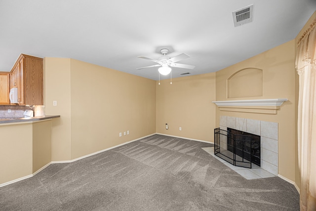 14319 Heron Marsh Dr, Cypress, TX 77429 - unfurnished living room with carpet, ceiling fan, and a fireplace