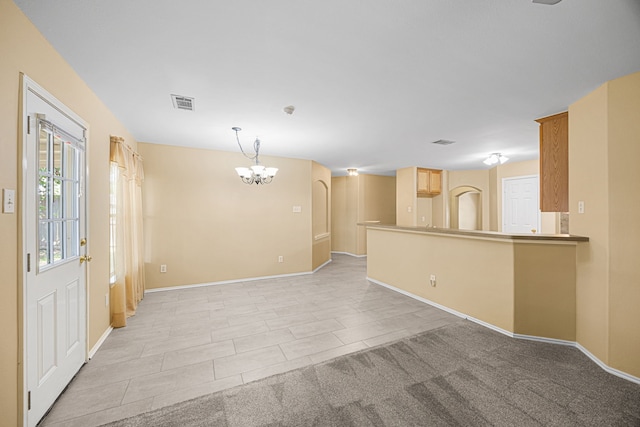 14319 Heron Marsh Dr, Cypress, TX 77429 - unfurnished living room featuring a chandelier and baseboards