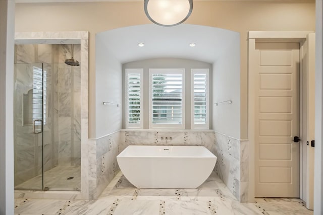 1116 W Drew St, Houston, TX 77006 - full bath with a marble finish shower, a soaking tub, tile walls, wainscoting, and marble tiled flooring