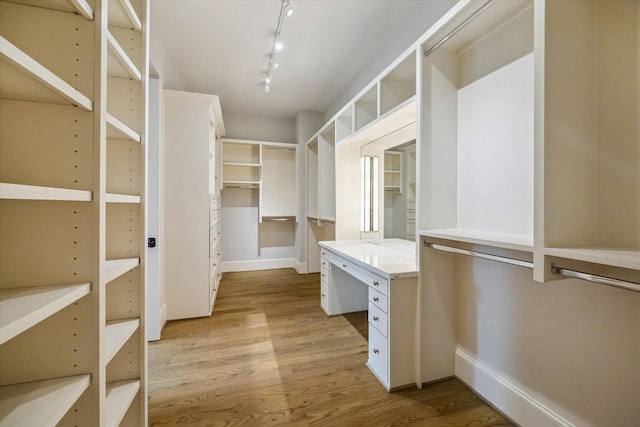 1116 W Drew St, Houston, TX 77006 - walk in closet with light wood finished floors