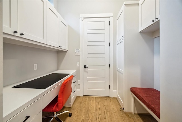 1116 W Drew St, Houston, TX 77006 - home office featuring light wood-style flooring and built in study area