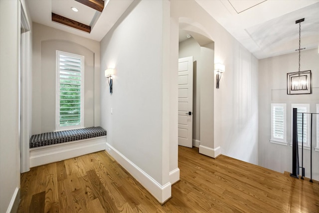 1116 W Drew St, Houston, TX 77006 - hallway featuring light wood-style flooring and a chandelier