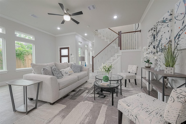 7108 Saint Augustine St, Houston, TX 77021 - living area featuring ceiling fan, crown molding, stairs, and recessed lighting