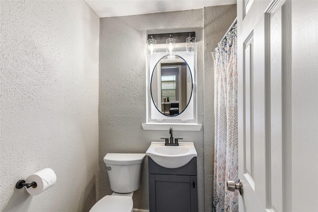 3318 Europa St, Houston, TX 77022 - bathroom featuring vanity and a textured wall