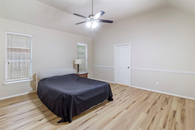 14510 Kings Head Dr, Houston, TX 77044 - bedroom featuring lofted ceiling, light wood-style flooring, and a ceiling fan
