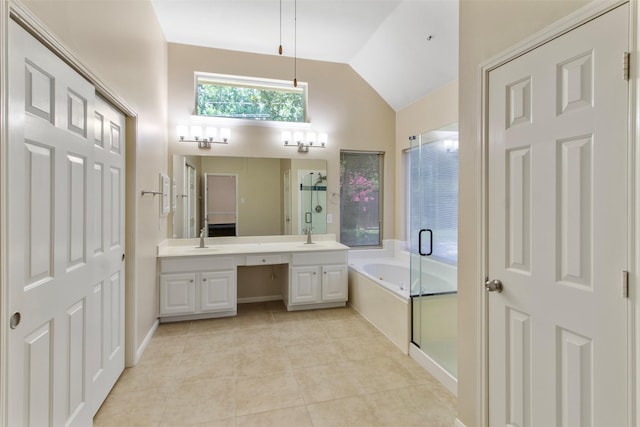 14510 Kings Head Dr, Houston, TX 77044 - full bath featuring a bath, vaulted ceiling, double vanity, a shower stall, and tile patterned flooring