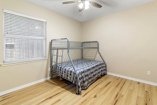 14510 Kings Head Dr, Houston, TX 77044 - bedroom with wood finished floors and a ceiling fan