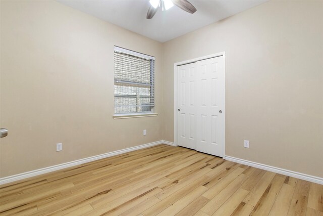 14510 Kings Head Dr, Houston, TX 77044 - unfurnished bedroom with wood finished floors, a closet, and ceiling fan