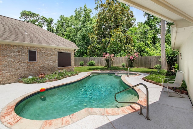 14510 Kings Head Dr, Houston, TX 77044 - view of swimming pool featuring a fenced backyard, a patio area, and a pool with connected hot tub