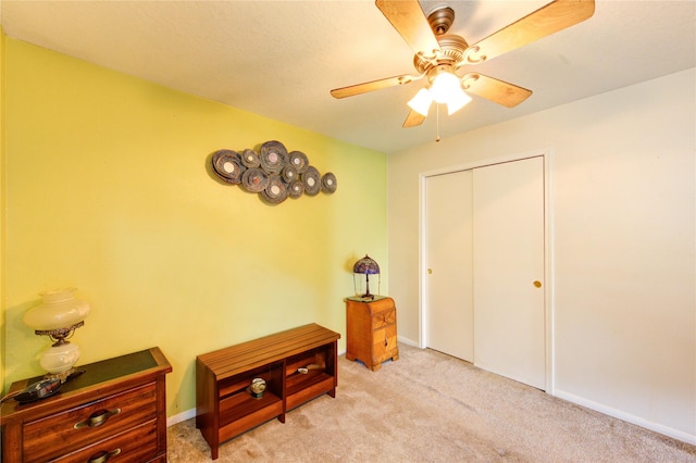 11734 Filaree Trl, Houston, TX 77044 - bedroom with light carpet, a closet, and a ceiling fan