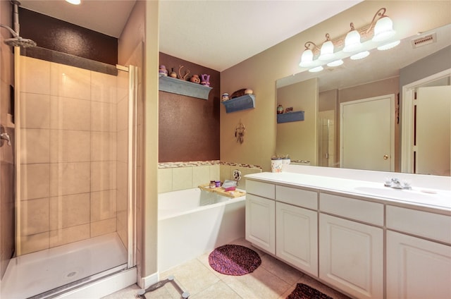 11734 Filaree Trl, Houston, TX 77044 - full bathroom featuring a shower stall, double vanity, a garden tub, and tile patterned flooring