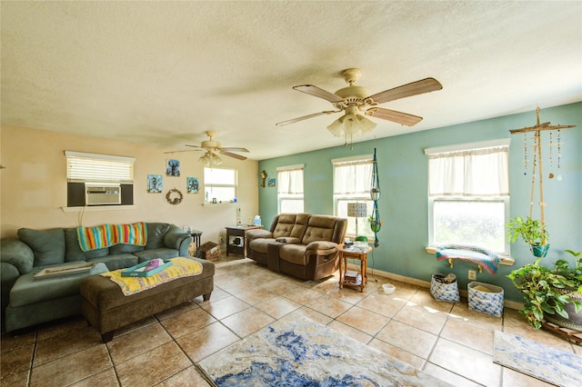 11734 Filaree Trl, Houston, TX 77044 - living room with cooling unit, healthy amount of natural light, ceiling fan, tile patterned floors, and a textured ceiling