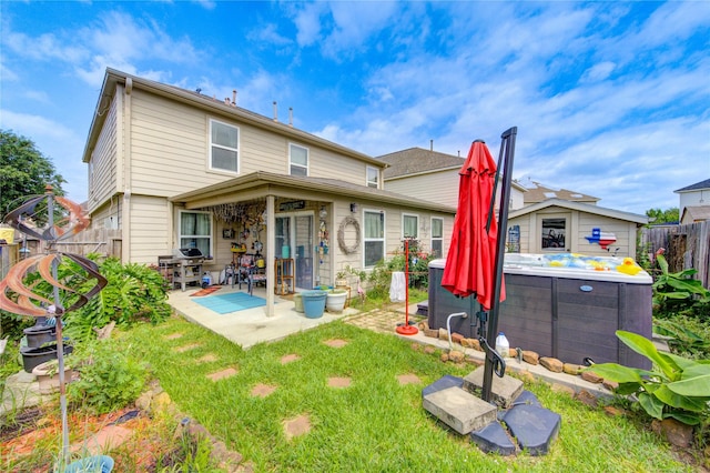 11734 Filaree Trl, Houston, TX 77044 - rear view of property with a patio area, a fenced backyard, and a hot tub