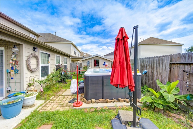 11734 Filaree Trl, Houston, TX 77044 - fenced backyard featuring a hot tub and a patio area
