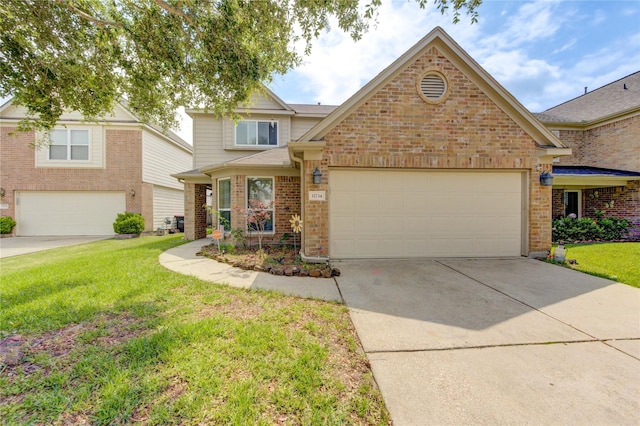 11734 Filaree Trl, Houston, TX 77044 - traditional-style home with driveway, a front yard, brick siding, and an attached garage