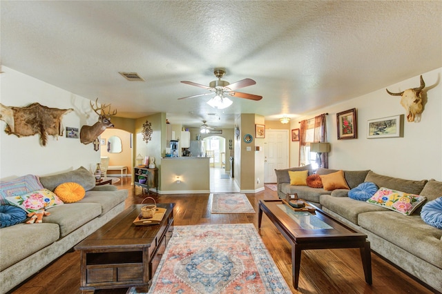11734 Filaree Trl, Houston, TX 77044 - living room featuring ceiling fan, wood finished floors, and a textured ceiling