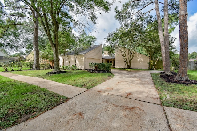 1010 Rock Canyon Dr, Katy, TX 77450 - mid-century modern home with driveway and a garage