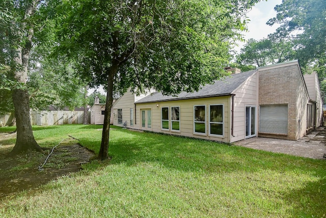 1010 Rock Canyon Dr, Katy, TX 77450 - back of property with a chimney and a shingled roof