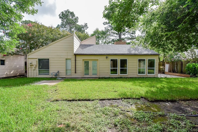1010 Rock Canyon Dr, Katy, TX 77450 - back of house with french doors, a chimney, and roof with shingles