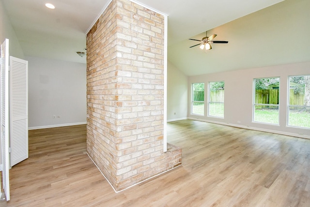 1010 Rock Canyon Dr, Katy, TX 77450 - unfurnished living room with healthy amount of natural light, a ceiling fan, light wood finished floors, and high vaulted ceiling