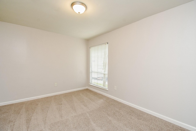 1010 Rock Canyon Dr, Katy, TX 77450 - empty room featuring baseboards and light colored carpet