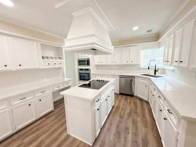 16627 Aldenham Pl, Spring, TX 77379 - kitchen featuring stainless steel appliances, a center island, open shelves, wood finished floors, and white cabinets